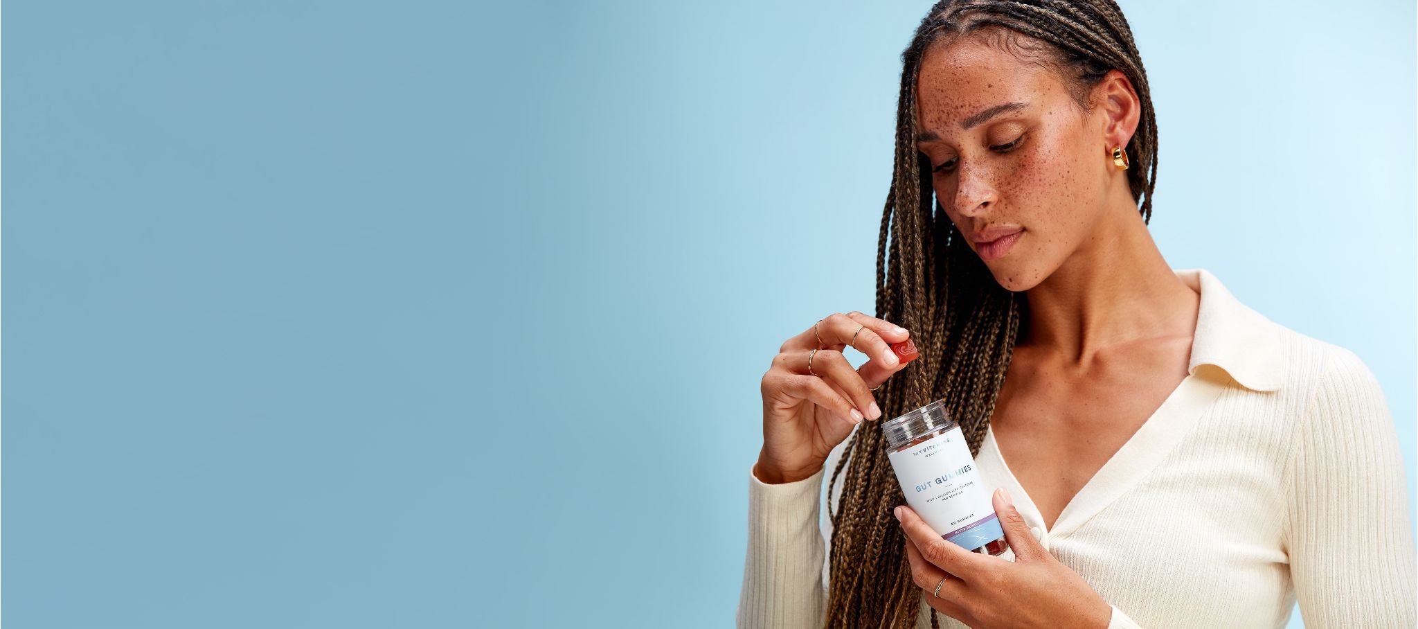 Woman holding Myvitamins Gut Gummies